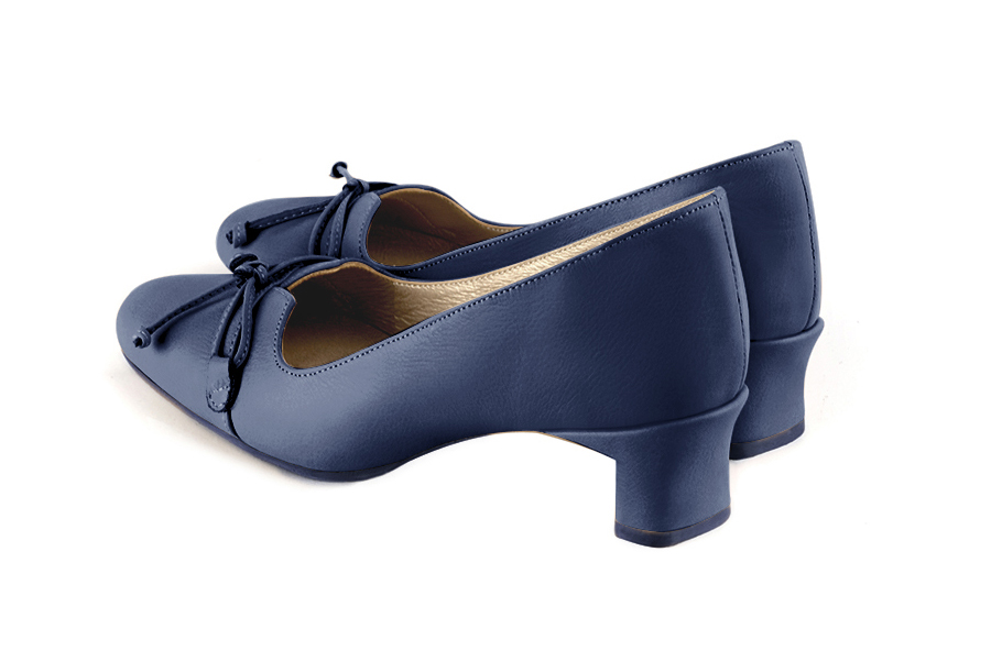 French elegance and refinement for these prussian blue dress pumps, with a knot on the front, 
                available in many subtle leather and colour combinations. With its original cut, this pretty low-heeled pump
will serve you well, combining comfort and distinction. 
                Matching clutches for parties, ceremonies and weddings.   
                You can customize these shoes to perfectly match your tastes or needs, and have a unique model.  
                Choice of leathers, colours, knots and heels. 
                Wide range of materials and shades carefully chosen.  
                Rich collection of flat, low, mid and high heels.  
                Small and large shoe sizes - Florence KOOIJMAN